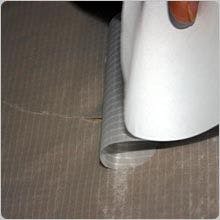 Carefully roll the patch onto the tear whilst holding the material either side taught. Carefully roll the patch onto the tear whilst holding the material either side taught.
