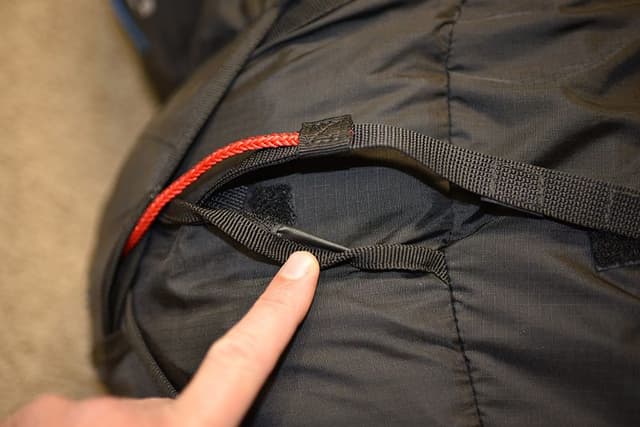 Incorrect, make sure the strap is routed below the small Velcro patch.